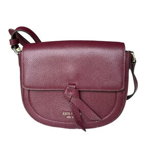 Kate Spade New York Classic Knott Pebbled Leather Medium Saddle Bag in Grenache